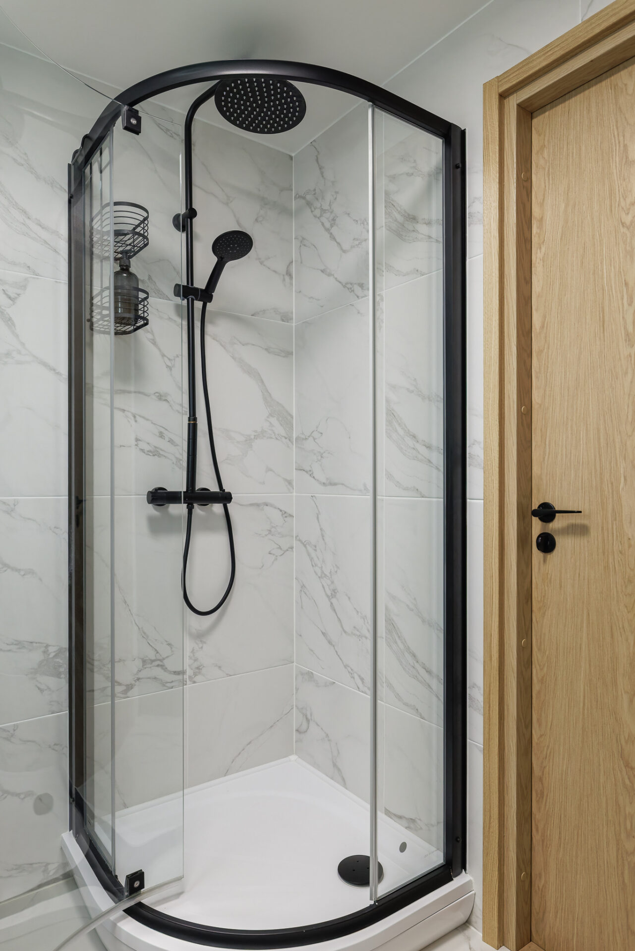 Modern shower corner with marble style bathroom interior at Kuressaare Stays apartment in Saaremaa